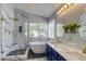 Bright bathroom features a glass shower, soaking tub, double sinks and vanity at 1833 Winners Cup Dr, Las Vegas, NV 89117