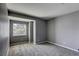 Neutral bedroom offers a large window, soft carpet and a spacious layout at 1833 Winners Cup Dr, Las Vegas, NV 89117