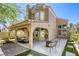 Home's exterior showcases a covered patio for outdoor enjoyment and relaxation at 1833 Winners Cup Dr, Las Vegas, NV 89117