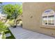 Home's exterior view shows a covered patio and neat landscaping at 1833 Winners Cup Dr, Las Vegas, NV 89117