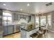 Gorgeous kitchen featuring stainless appliances, island with bar stool seating and granite counters at 1833 Winners Cup Dr, Las Vegas, NV 89117