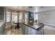 Open kitchen and living area with an island, stainless steel appliances, and natural lighting at 1833 Winners Cup Dr, Las Vegas, NV 89117