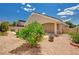 Landscaped backyard with lush greenery, potted plants, and a view of the inviting pool at 2150 Ponticello Dr, Henderson, NV 89052