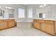 Bright bathroom with a large soaking tub, double vanities, and tiled floor at 2150 Ponticello Dr, Henderson, NV 89052