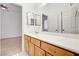 Bathroom vanity with light wood cabinets and a large mirror at 2150 Ponticello Dr, Henderson, NV 89052