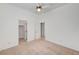 Neutral bedroom with closet, ceiling fan, and two doors at 2150 Ponticello Dr, Henderson, NV 89052