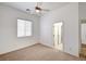 Neutral bedroom with carpet, a ceiling fan, and a window at 2150 Ponticello Dr, Henderson, NV 89052