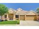 Charming single-story home with a well-manicured lawn, desert landscaping and a three-car garage at 2150 Ponticello Dr, Henderson, NV 89052