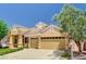 Charming single-story home showcasing desert landscaping and a spacious three-car garage at 2150 Ponticello Dr, Henderson, NV 89052