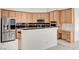 Kitchen featuring light wood cabinets, stainless steel appliances, and a center island at 2150 Ponticello Dr, Henderson, NV 89052