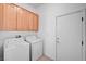 This laundry room has a side-by-side washer and dryer set at 2150 Ponticello Dr, Henderson, NV 89052