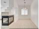 Cozy living room with neutral tile flooring and black fireplace at 2150 Ponticello Dr, Henderson, NV 89052