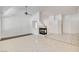 Spacious living room with neutral tile flooring, fireplace, high ceilings and a ceiling fan at 2150 Ponticello Dr, Henderson, NV 89052