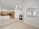 Open-concept living area featuring a cozy fireplace and lots of natural light at 2150 Ponticello Dr, Henderson, NV 89052