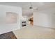 Bright living space featuring ceramic tile flooring, neutral walls, and a fireplace at 2150 Ponticello Dr, Henderson, NV 89052