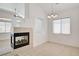 Living room with neutral tile flooring and black fireplace at 2150 Ponticello Dr, Henderson, NV 89052