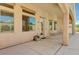 Covered patio featuring three large windows and a door to the backyard at 2150 Ponticello Dr, Henderson, NV 89052