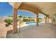 Relaxing pool and landscaped backyard with a covered patio for outdoor enjoyment at 2150 Ponticello Dr, Henderson, NV 89052