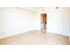 Bright, open bedroom with neutral tile floors and a view into a bathroom at 222 Karen Ave # 2506, Las Vegas, NV 89109