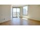 Bright bedroom with tile floors, a large window, and access to a balcony with views at 222 Karen Ave # 2506, Las Vegas, NV 89109