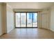 Bright living space with tile floors and expansive sliding glass doors offering city views at 222 Karen Ave # 2506, Las Vegas, NV 89109
