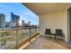 Relax on this condo balcony with patio furniture and enjoy city views at 222 Karen Ave # 601, Las Vegas, NV 89109
