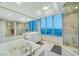 Bathroom with large window, tub, shower, and white cabinets for a spa-like feel at 222 Karen Ave # 601, Las Vegas, NV 89109