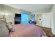 Bedroom featuring sliding glass doors, a bathroom and views of the city at 222 Karen Ave # 601, Las Vegas, NV 89109