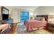 Bedroom with wooden floors, with a large dresser and sliding glass doors to a patio at 222 Karen Ave # 601, Las Vegas, NV 89109