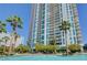 High-rise condo building with balconies, palm trees, and a pool area for residents at 222 Karen Ave # 601, Las Vegas, NV 89109