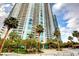 Beautiful high-rise building with multiple balconies and lush palm trees in the foreground at 222 Karen Ave # 601, Las Vegas, NV 89109