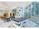 Stylish game room with a billiard table and large windows, offering a space to relax at 222 Karen Ave # 601, Las Vegas, NV 89109