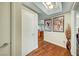 Hallway with hardwood floors and decorative artwork on the walls at 222 Karen Ave # 601, Las Vegas, NV 89109