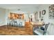 Bright kitchen and dining area boasts stainless steel appliances and granite countertops with wood flooring at 222 Karen Ave # 601, Las Vegas, NV 89109