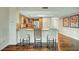 Kitchen island features barstool seating with modern countertops, cabinetry, and lighting at 222 Karen Ave # 601, Las Vegas, NV 89109