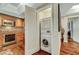 A modern kitchen with light wood cabinets, stainless steel appliances and in-unit stacked washer and dryer at 222 Karen Ave # 601, Las Vegas, NV 89109