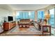 Spacious living room offering panoramic views through large windows and balcony access at 222 Karen Ave # 601, Las Vegas, NV 89109
