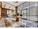 Bright, light-filled lobby with marble floors, floral arrangements, and comfortable seating area at 222 Karen Ave # 601, Las Vegas, NV 89109