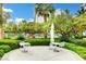 Charming outdoor seating area with manicured landscaping and elegant white furniture at 222 Karen Ave # 601, Las Vegas, NV 89109