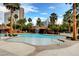Stunning pool area with rock waterfall feature surrounded by lush tropical landscaping at 222 Karen Ave # 601, Las Vegas, NV 89109