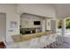 Poolside bar with granite countertop, seating, and stainless steel appliances at 222 Karen Ave # 601, Las Vegas, NV 89109
