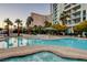 Resort-style pool with hot tub, lounge chairs, and views of the surrounding high-rise buildings at 222 Karen Ave # 601, Las Vegas, NV 89109