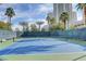 Well-maintained outdoor tennis court with palm trees and high-rise buildings in the background at 222 Karen Ave # 601, Las Vegas, NV 89109