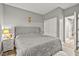 Bedroom features a queen bed, carpet flooring, and an ensuite bathroom at 2250 Tedesca Dr, Henderson, NV 89052