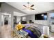 Large bedroom with ceiling fan, wood floors, and a connected living space at 2250 Tedesca Dr, Henderson, NV 89052