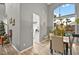 The dining area is adjacent to the kitchen and features hardwood floors and a view of the backyard at 2250 Tedesca Dr, Henderson, NV 89052