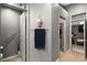 Hallway features a convenient half bath with grab bar and doorways to other rooms at 2250 Tedesca Dr, Henderson, NV 89052