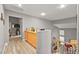 Upstairs hallway with wood floors, wood cabinets, and view of the stairs at 2250 Tedesca Dr, Henderson, NV 89052