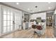 Modern kitchen with white cabinets, stainless steel appliances, and a breakfast bar with seating at 2250 Tedesca Dr, Henderson, NV 89052