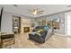 Comfortable living room features a fireplace, large windows, and hardwood flooring at 2250 Tedesca Dr, Henderson, NV 89052